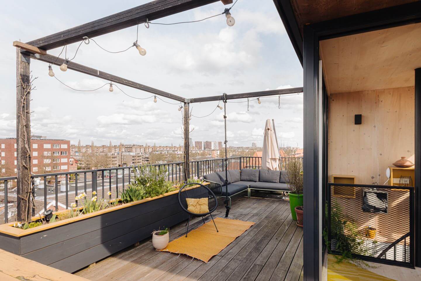 A Modern Loft-Style School Conversion in Amsterdam 25 roof terrace with planters