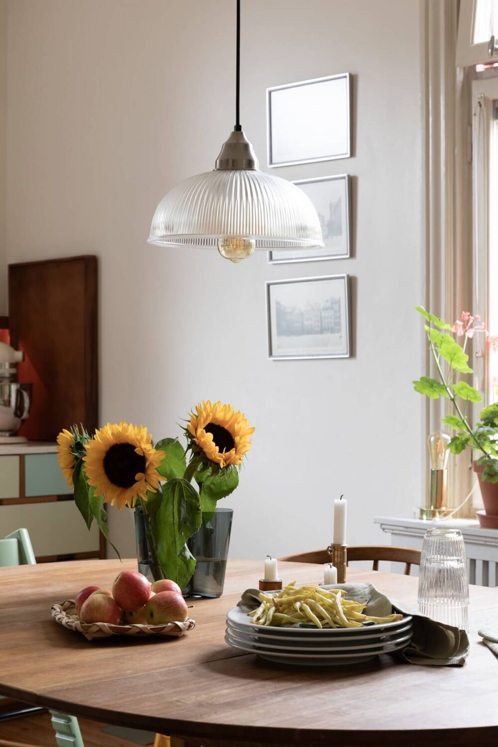A Swedish Duplex with a Unique Wood and Pastel Colored Kitchen 5 round dining table