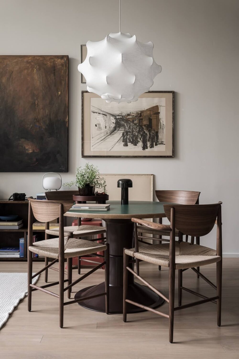 A Monochrome Loft with High Ceilings and Art 18 round dining table with wooden chairs