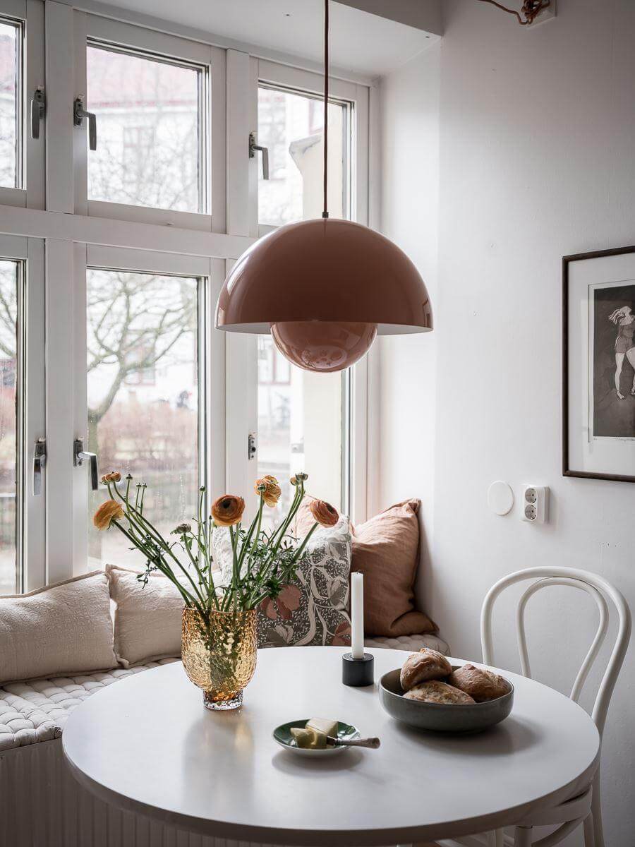 A Light Two Bedroom Apartment in Gothenburg 21 round kitchen table and window seat nordroom
