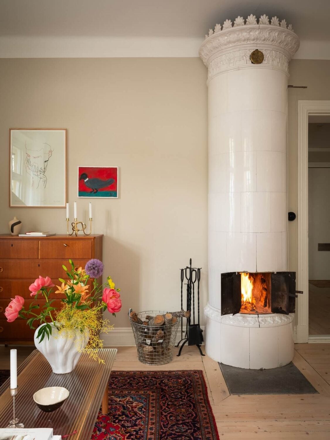 Original Details in a Light-Filled Swedish Apartment 5 round tiled fireplace living room