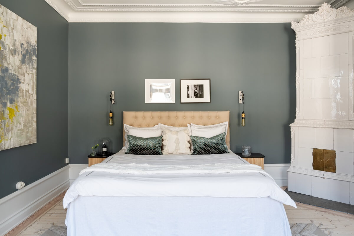 A Light Renovated Apartment in Stockholm 12 scandi bedroom with gray walls and fireplace