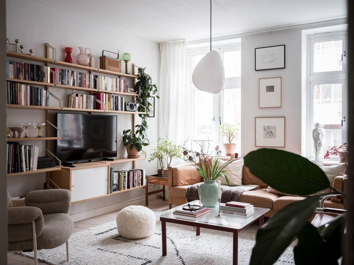 A Light Two Bedroom Apartment in Gothenburg 2 scandinavian living room with bookshelves
