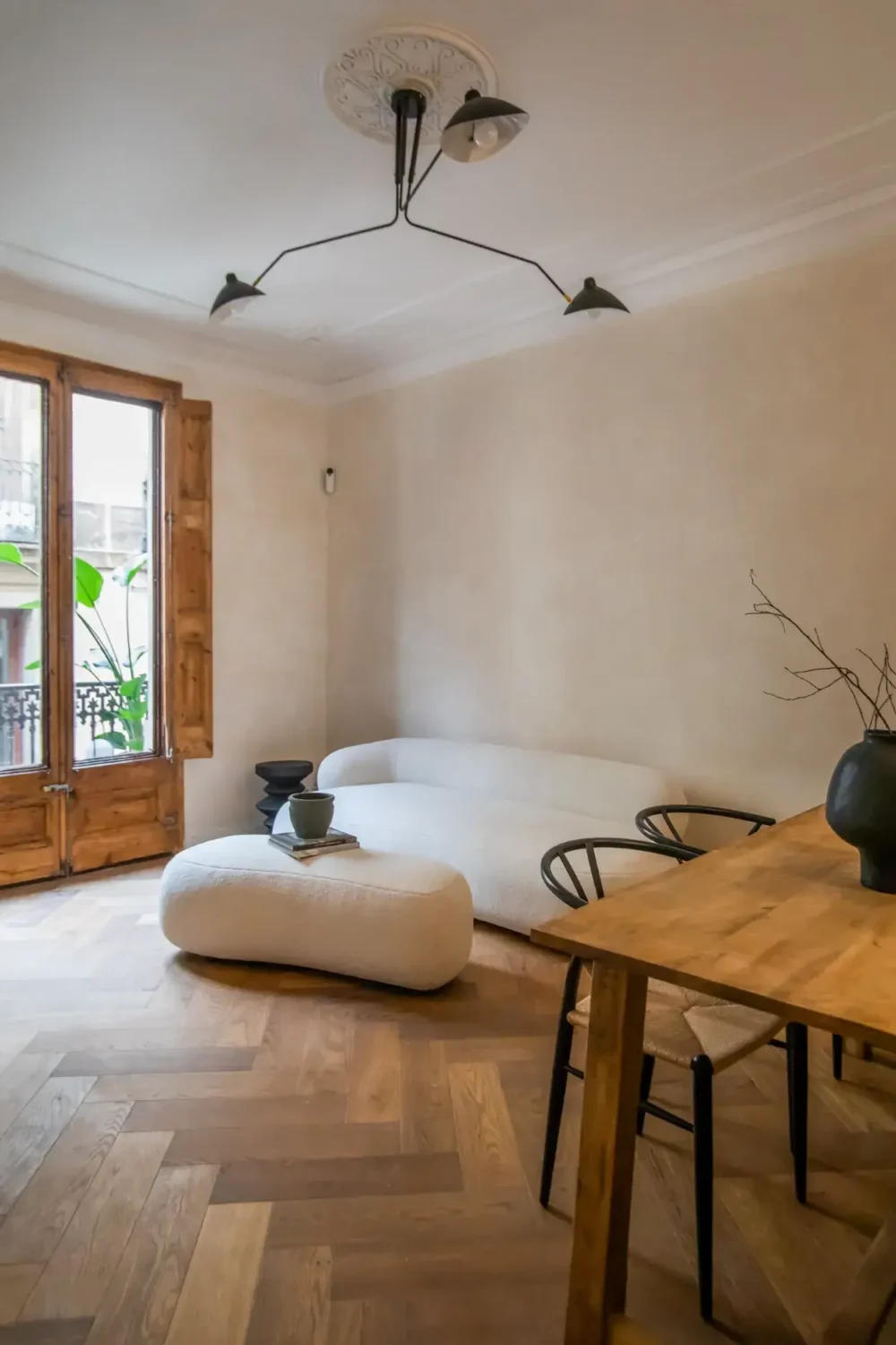 A Serene Apartment in Barcelona's Gothic Quarter 3 serene living room with herringbone wooden floor nordroom