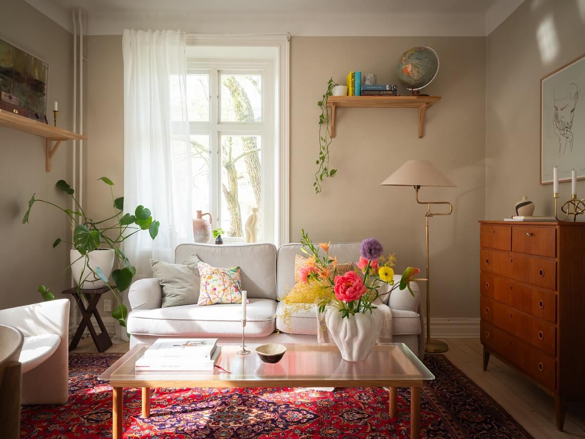 Original Details in a Light-Filled Swedish Apartment 3 serene living room with pink rug