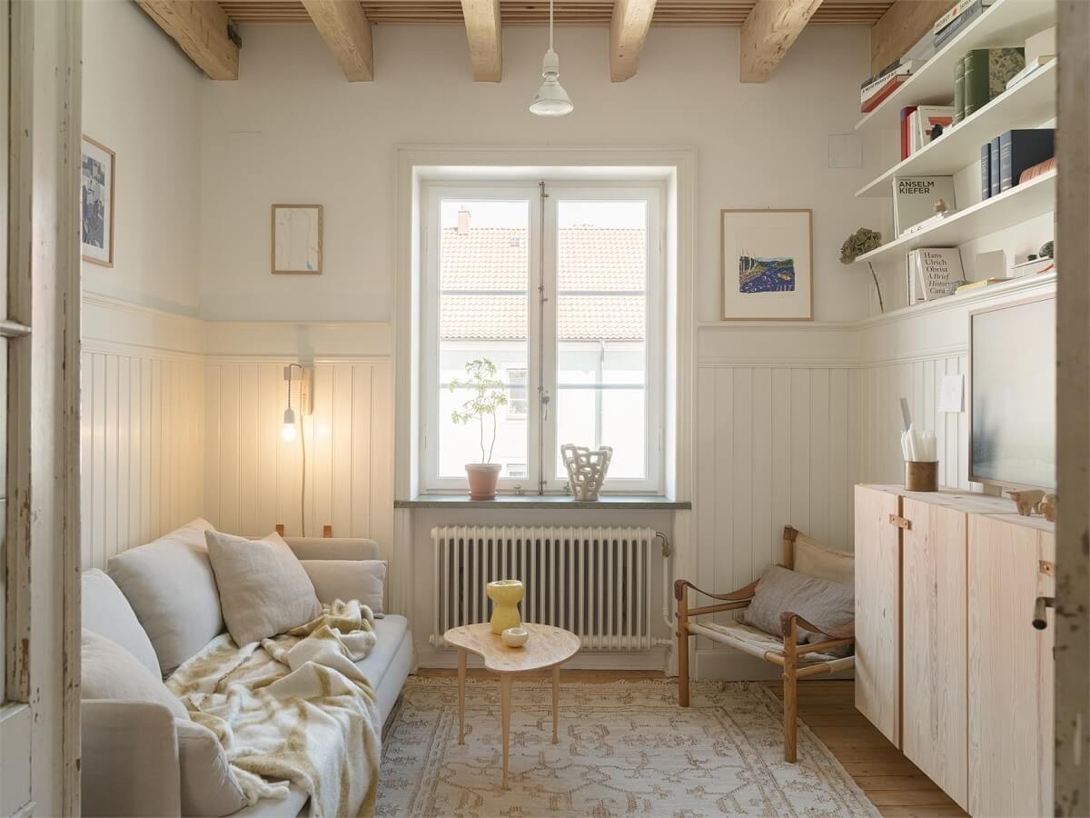 Wooden Details in a Light Duplex Apartment in Sweden 1 serene scandi living room with wooden beams