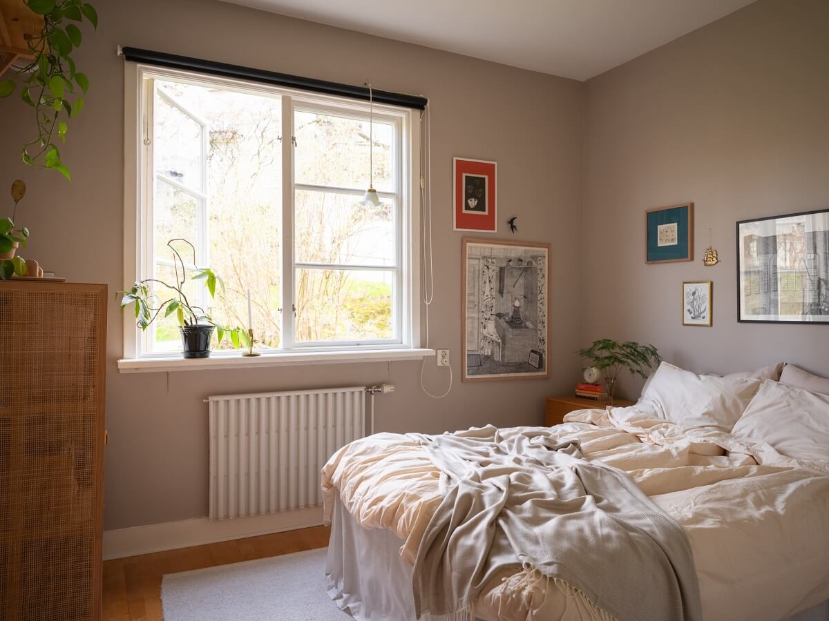 Warm Orange Tones in a Small Apartment 11 serene scandinavian bedroom