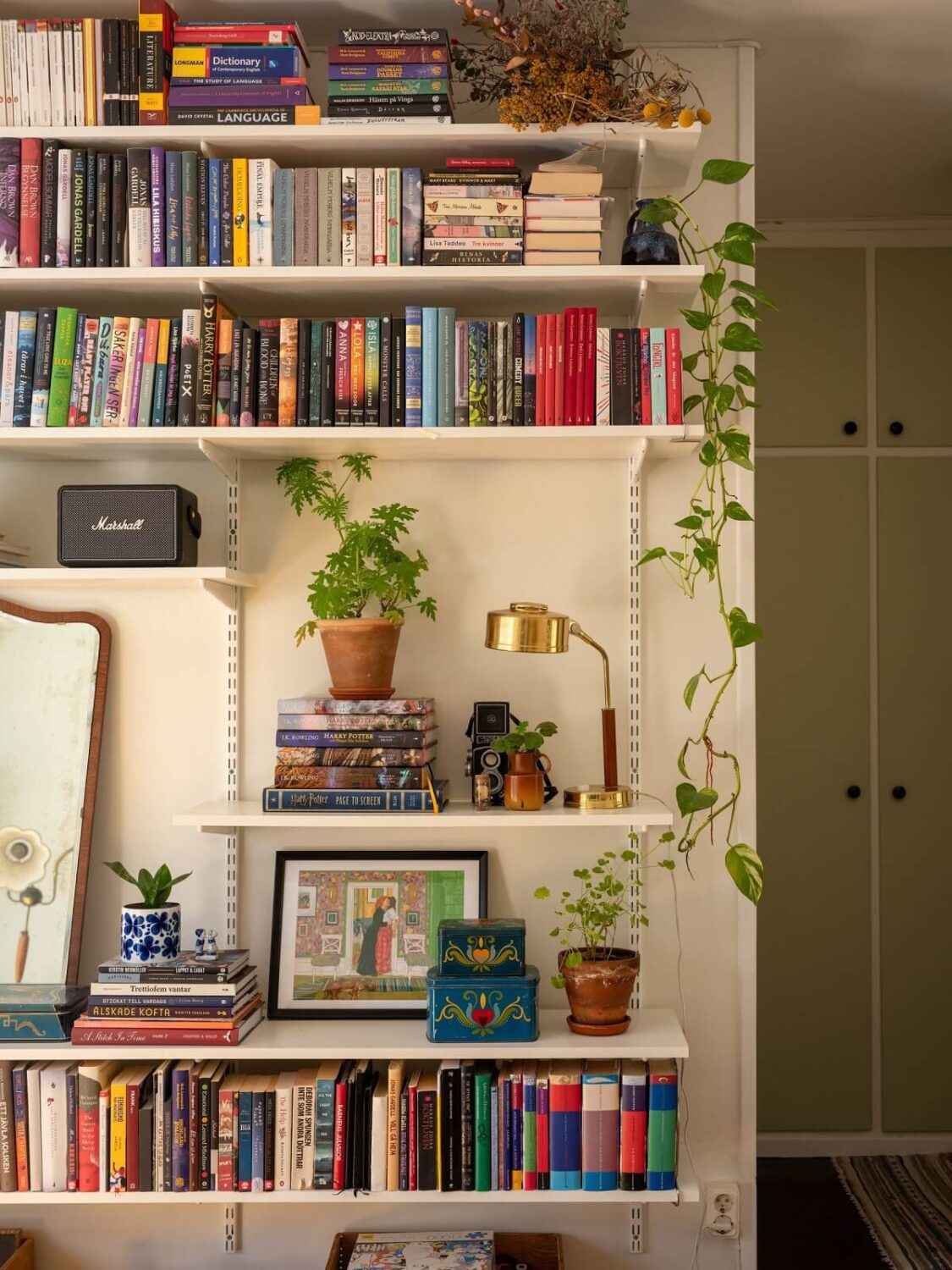 A Studio Apartment with Vintage Green Cabinets 5 shelves in studio