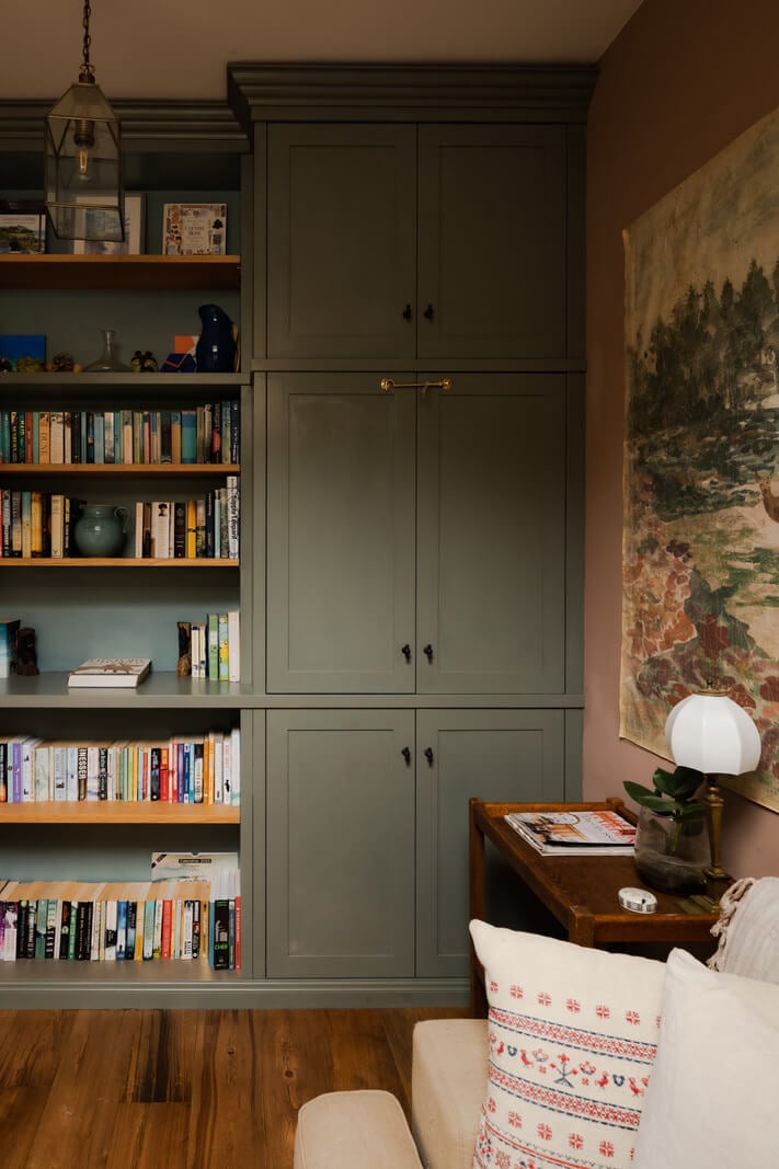 Ochre Yellow and Green Tones in a Cozy Welsh Cottage 14 sitting room pink walls built in booksheves nordroom