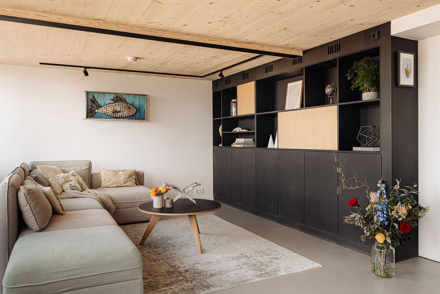 A Modern Loft-Style School Conversion in Amsterdam 12 sitting room with built in cabinets