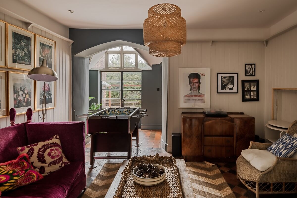 A Charming Gothic-Style Home with Original Details 5 sitting room with pink sofa nordroom