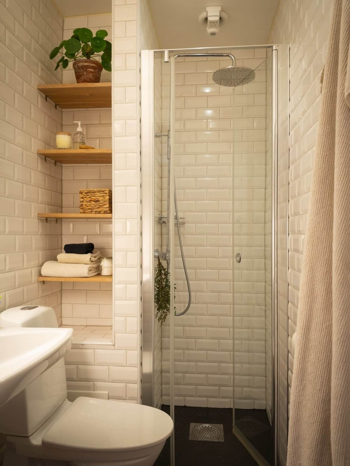 Warm Orange Tones in a Small Apartment 14 small bathroom white tiles and shelves in niche Warm Orange Tones in a Small Apartment