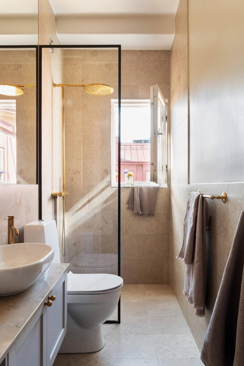 An Elegant Turn-of-the-Century Apartment in Stockholm 32 small bathroom with window and glass shower wall nordroom