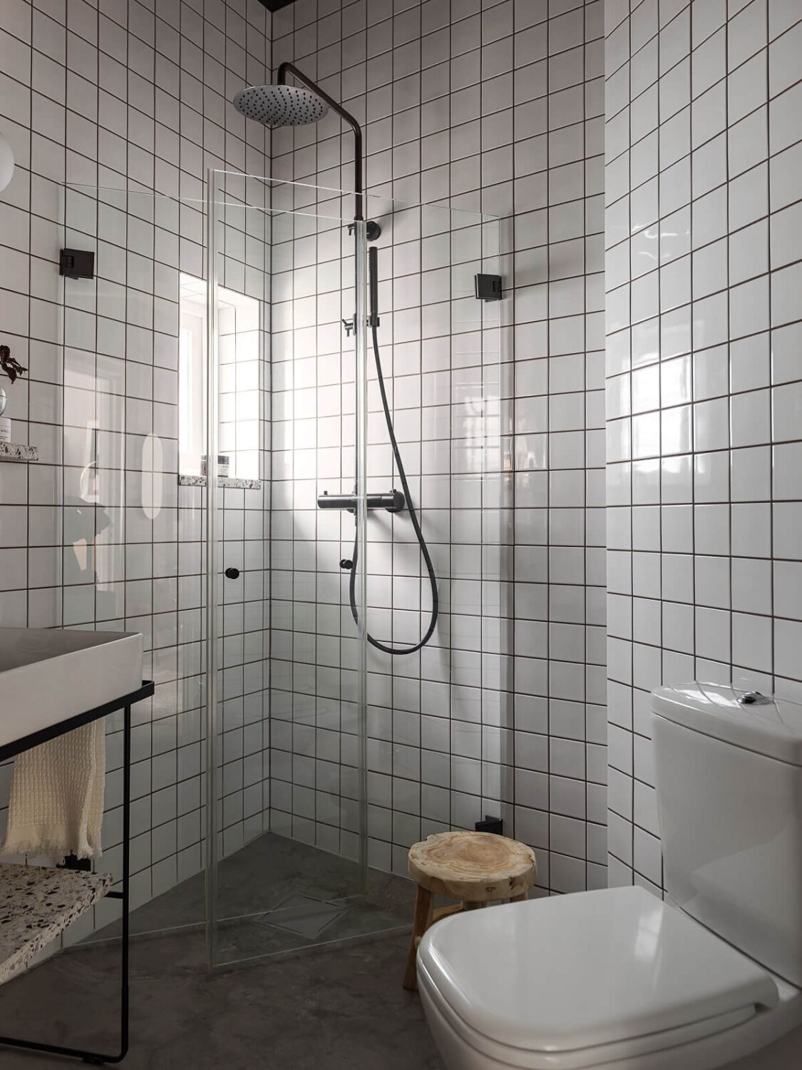 A Gray Stockholm Apartment with a Black Kitchen 16 small industrial style bathroom with white tiles nordroom
