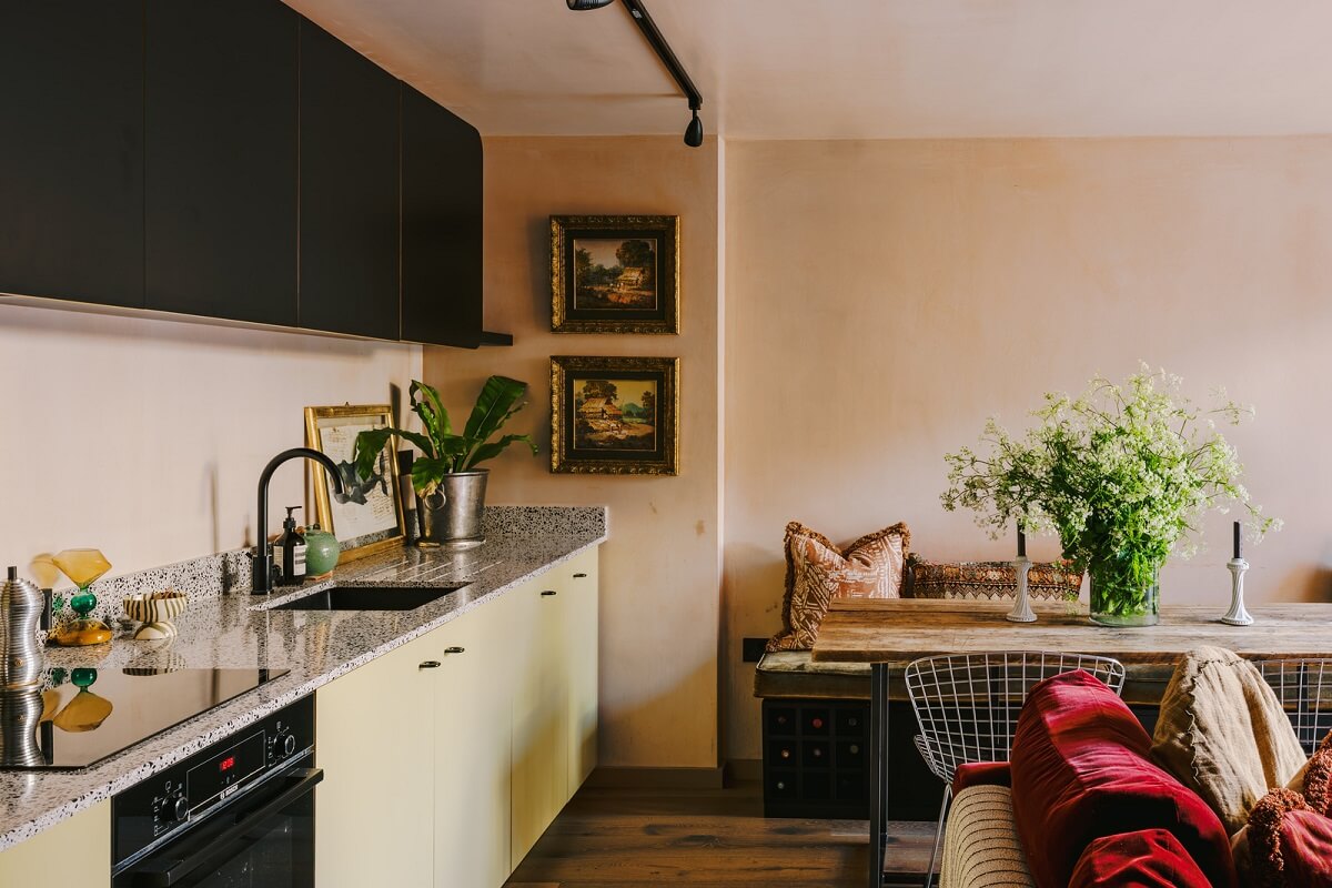 Warm Color Tones in a London Apartment with a Garden 3 small living room kitchen with yellow cabinets and dining table