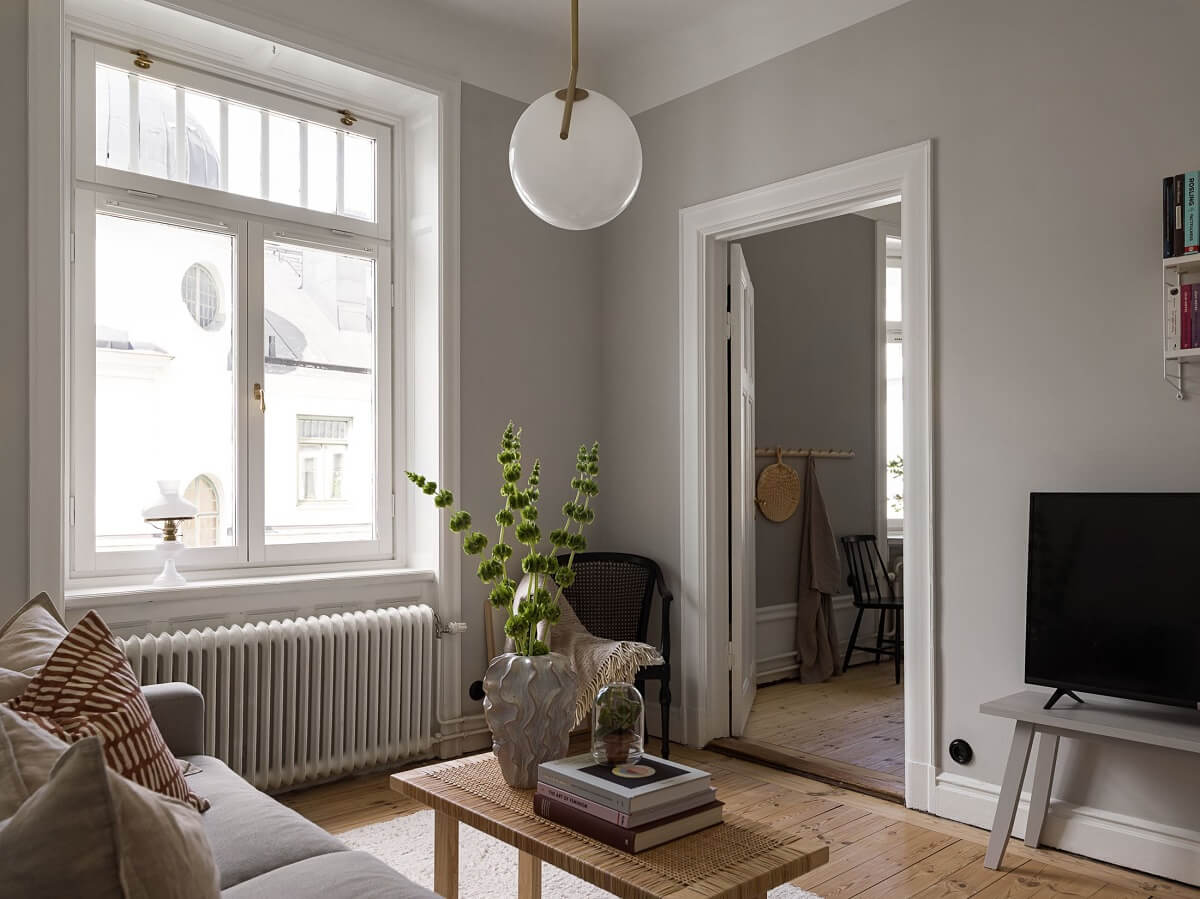 A Gray Stockholm Apartment with a Black Kitchen 2 small living room light gray walls