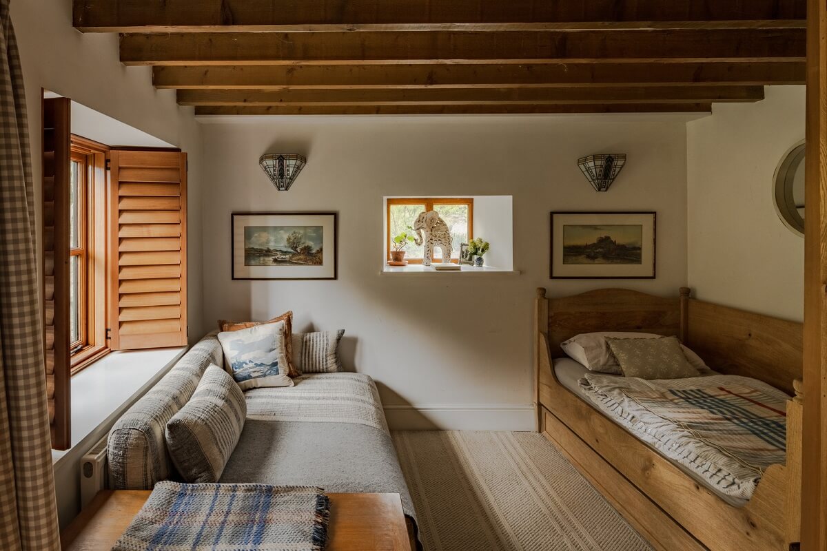 Ochre Yellow and Green Tones in a Cozy Welsh Cottage 15 spare bedroom wooden beams