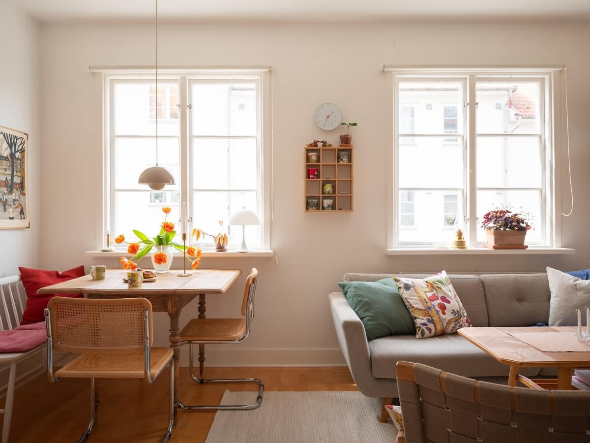 Warm Orange Tones in a Small Apartment 5 square dining table in living room