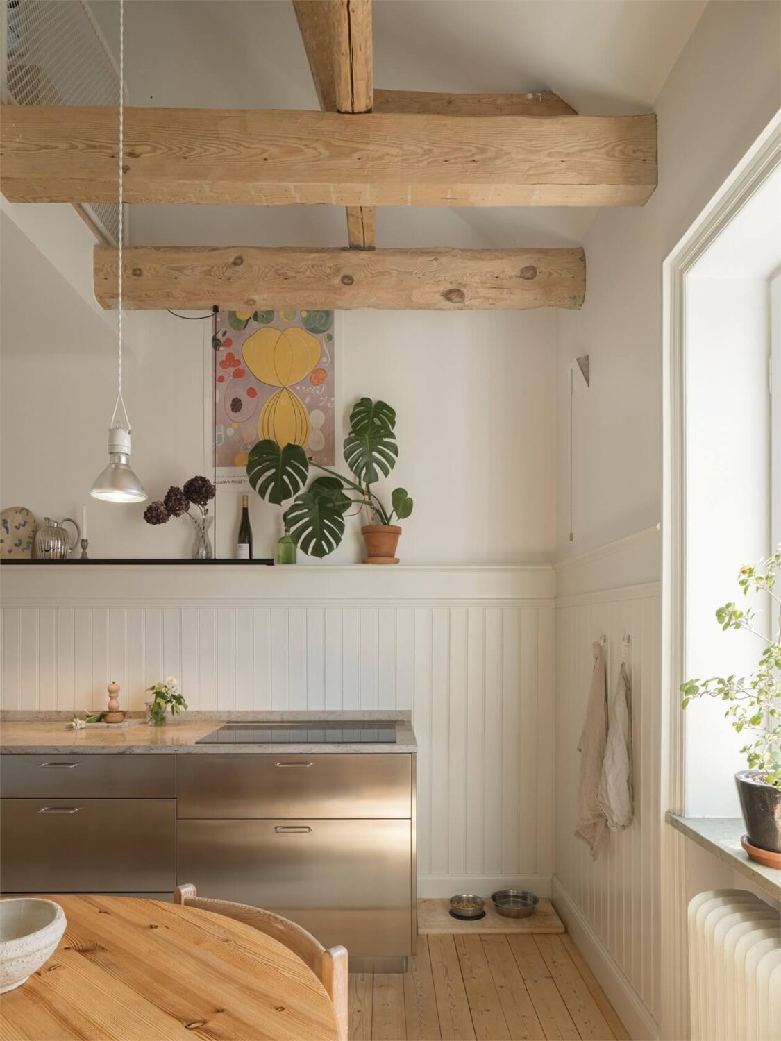 Wooden Details in a Light Duplex Apartment in Sweden 11 stainless steel kitchen