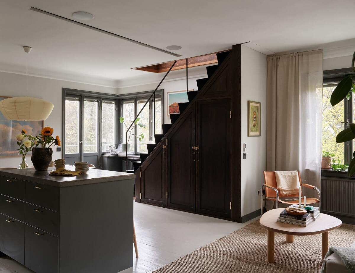 A Stunning Bathroom in a Duplex Apartment in Stockholm 4 staircase with cabinets underneath