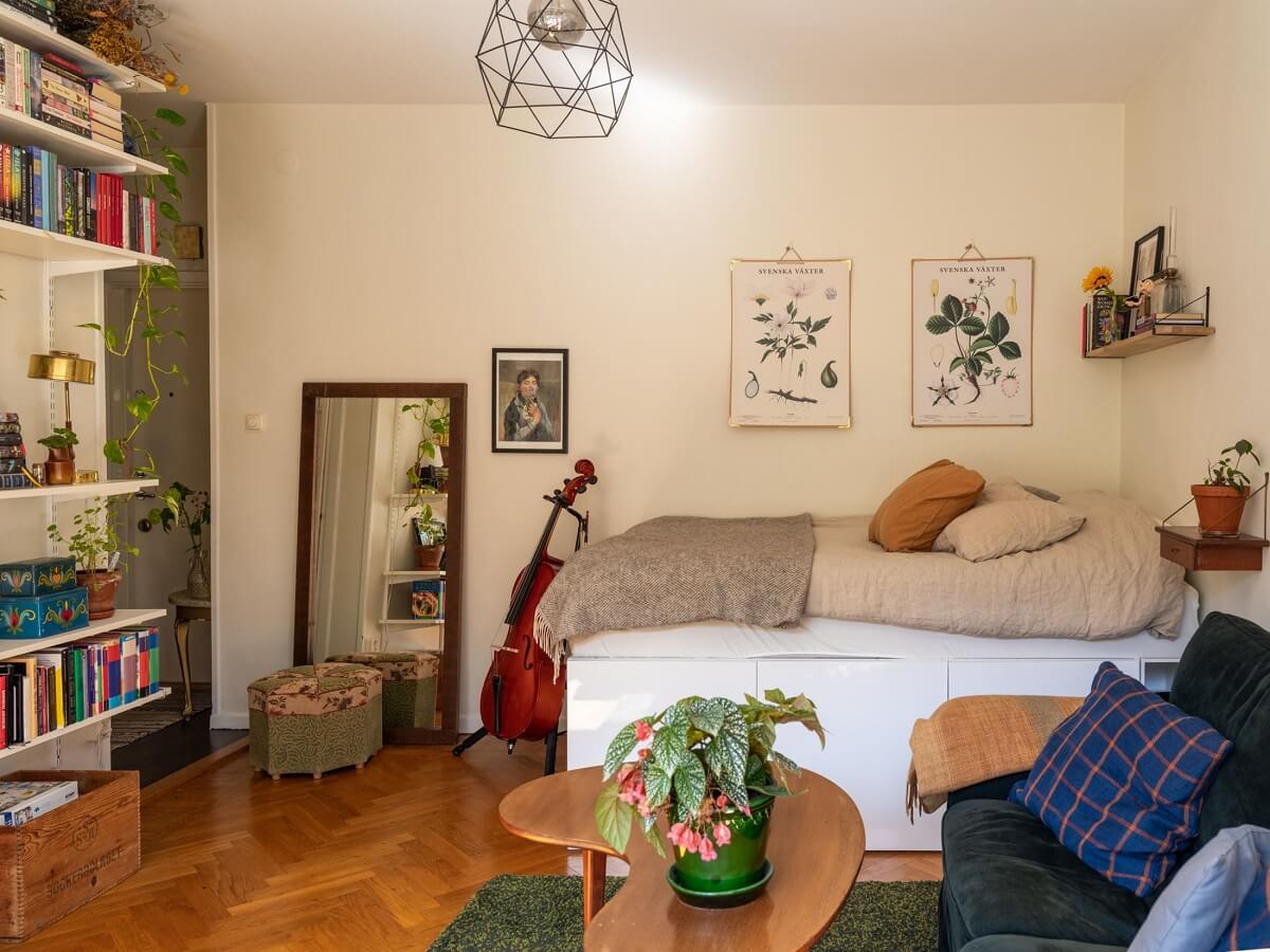 A Studio Apartment with Vintage Green Cabinets 3 studio apartment with shelves