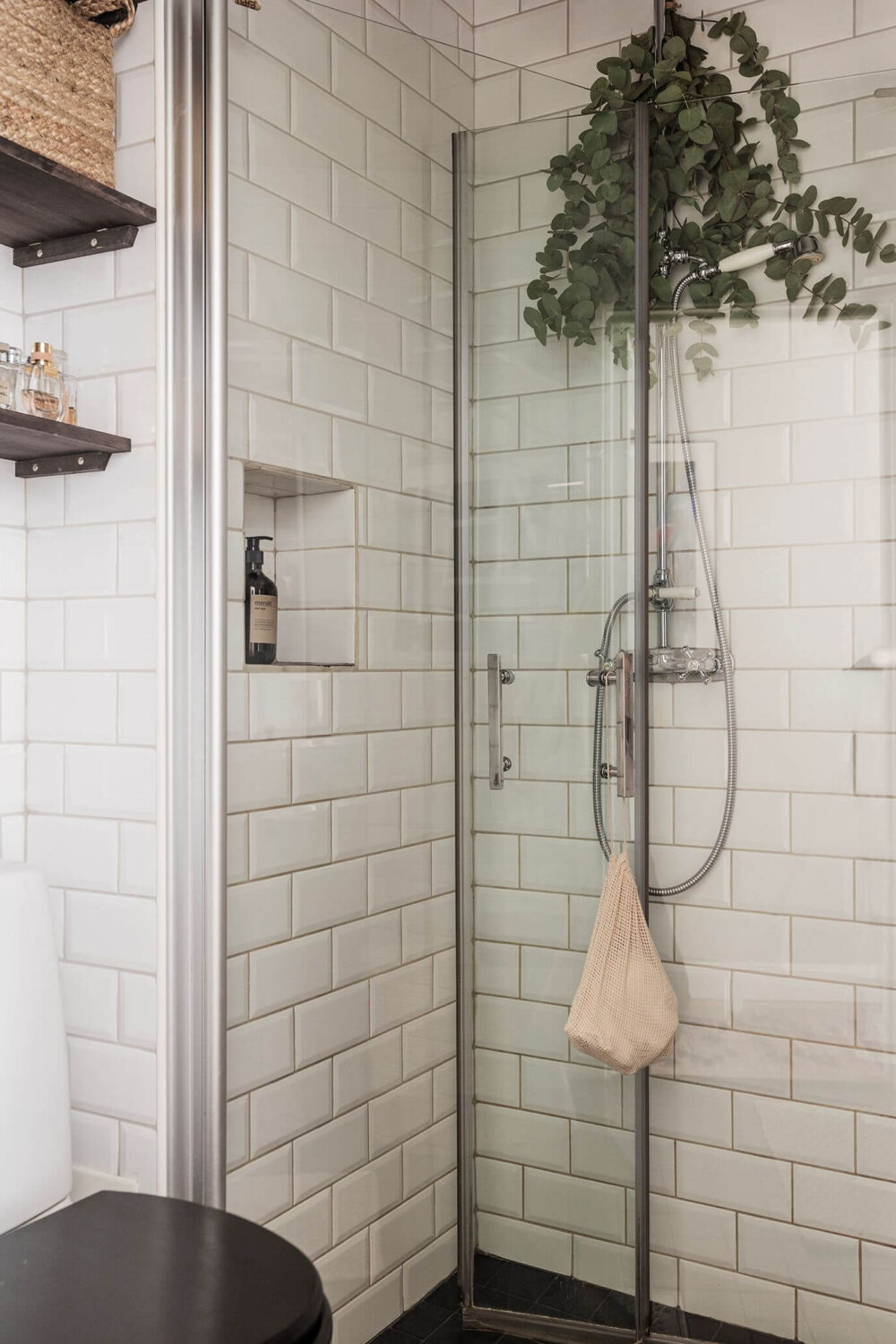 A Small Renovated 1920s Apartment in Stockholm 14 tiny bathroom with subway tiles