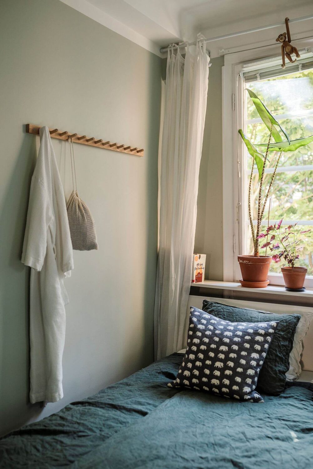 A Small Renovated 1920s Apartment in Stockholm 10 tiny bedroom with blue bedding nordroom