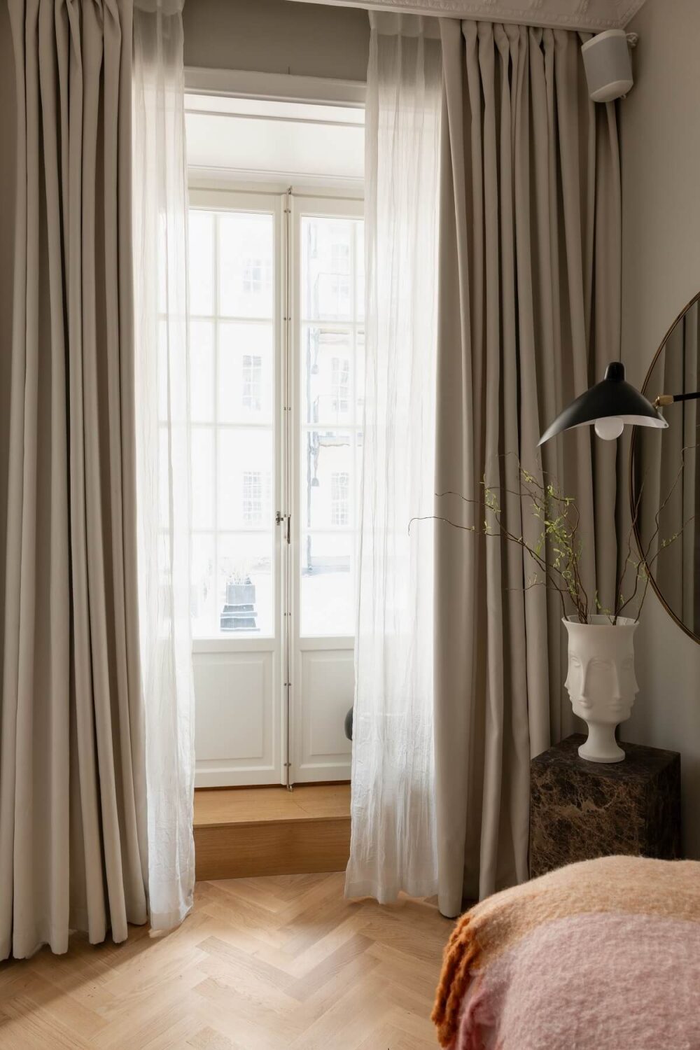 A Classic Look for a Swedish Apartment 11 tiny bedroom with large mirror