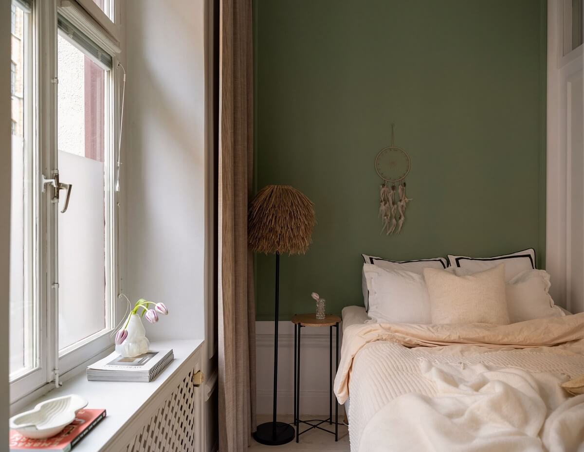 A Small, Tastefully Renovated Apartment in Stockholm 13 tiny living room with green wall nordroom