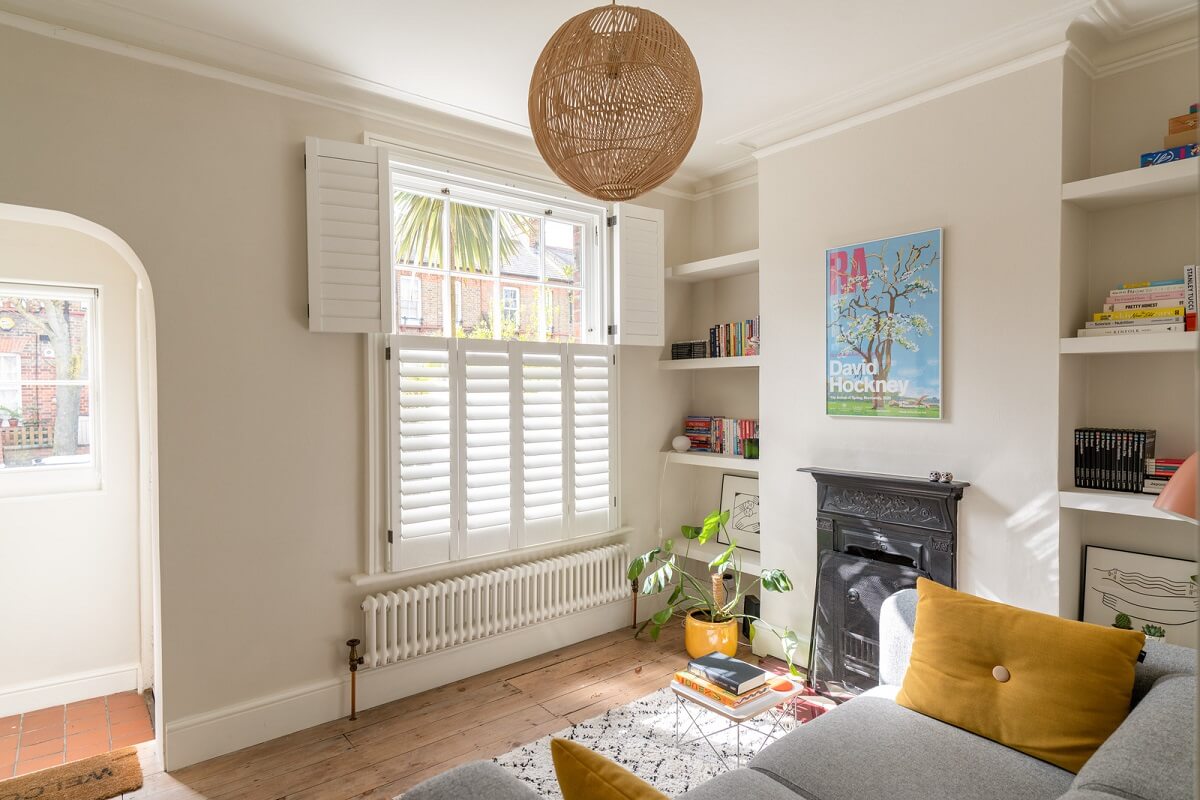 A Tiny Maisonette with Original Details in London 2 tiny-sitting-room-with-shelves-and-fireplace