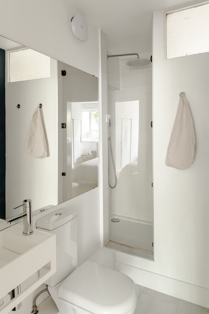 High Ceilings in a Light London Apartment 11 tiny white bathroom