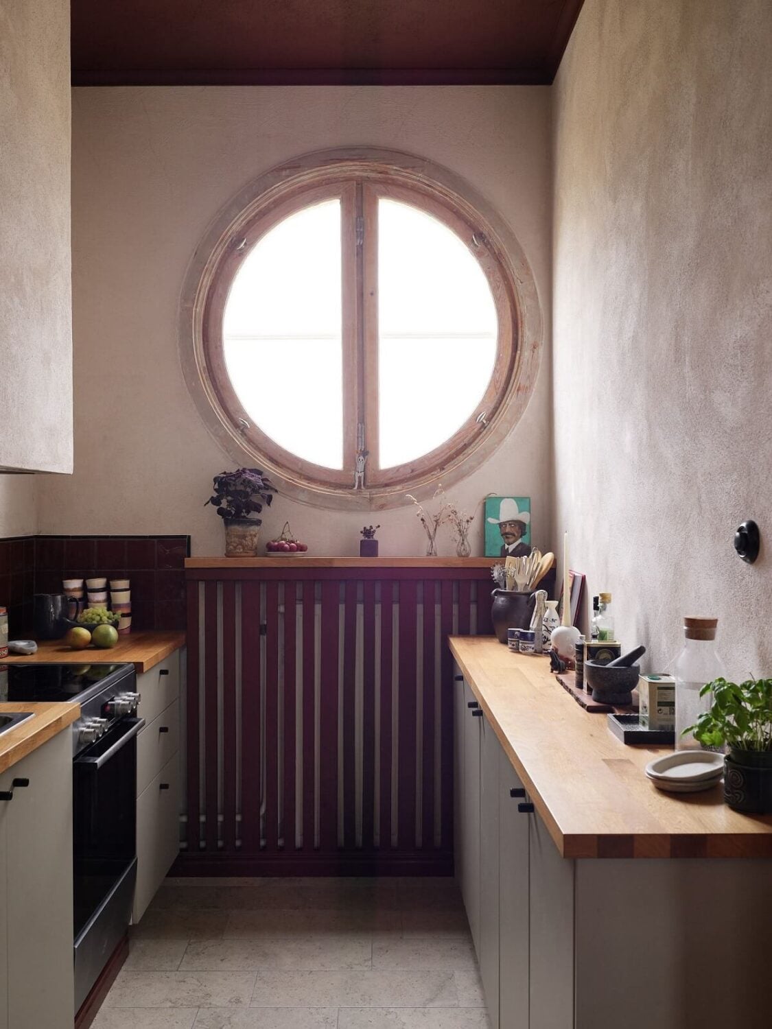 A Charming School Conversion in Sweden 7 utility room with round mirror