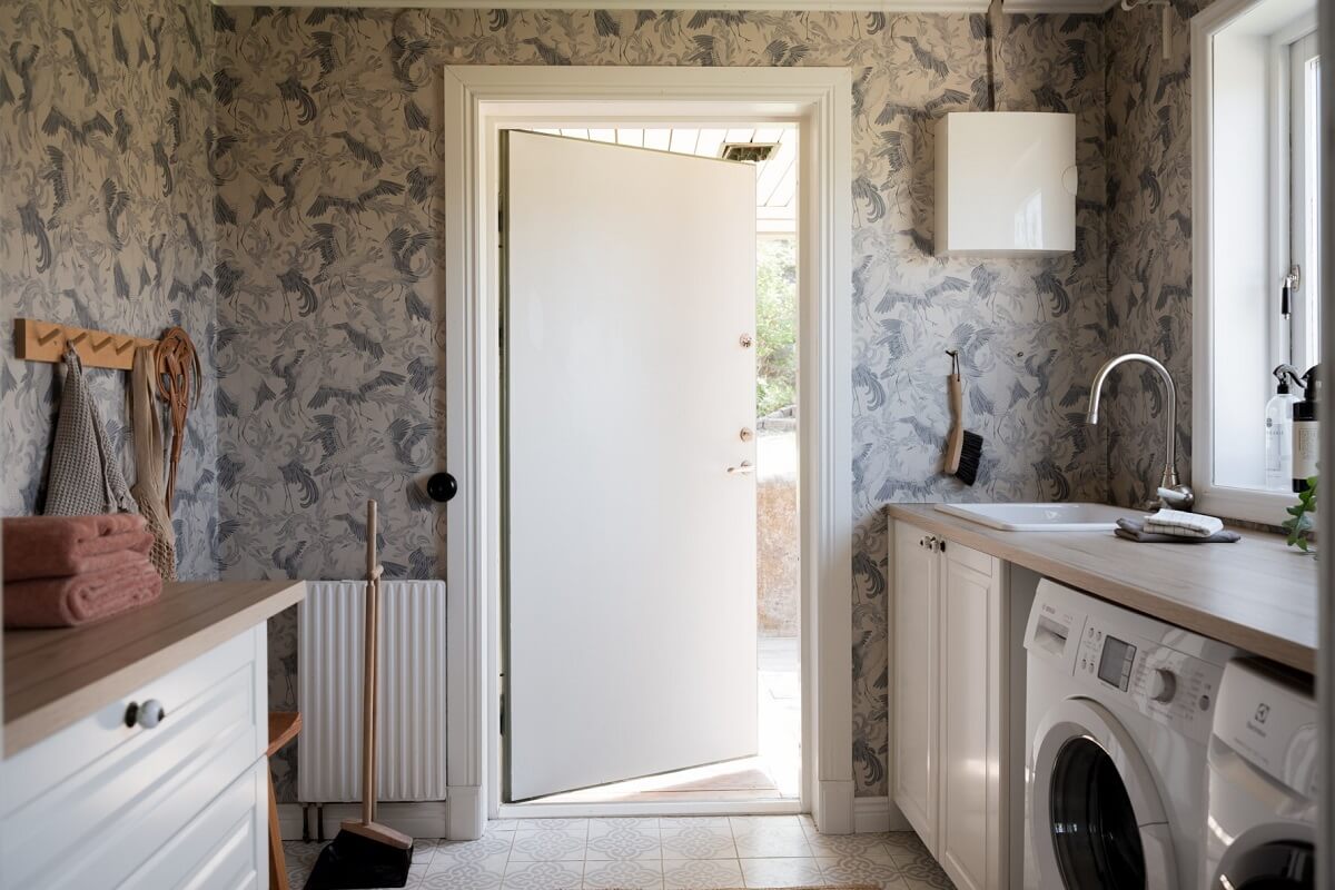 A Pink Swedish House with a Lovely Garden 11 utility room with wallpaper