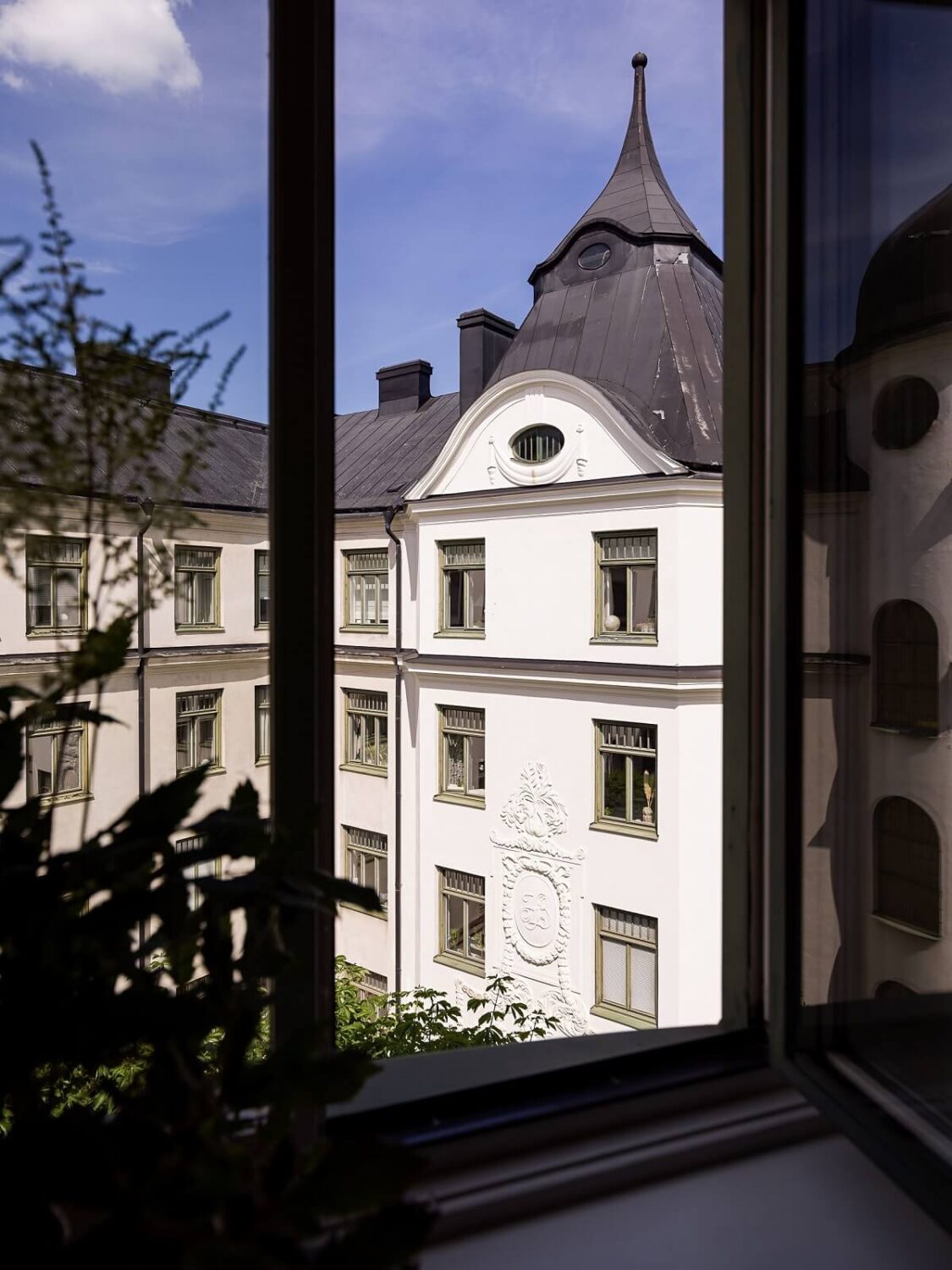 A Gray Stockholm Apartment with a Black Kitchen 15 view into courtyard