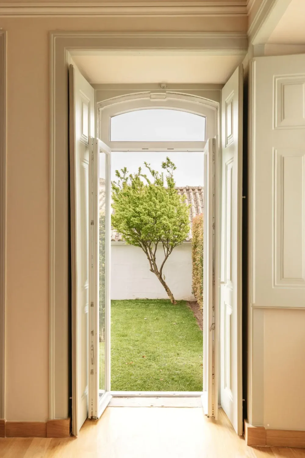 Color Touches in a Design Apartment in a Historic Villa 5 view into garden