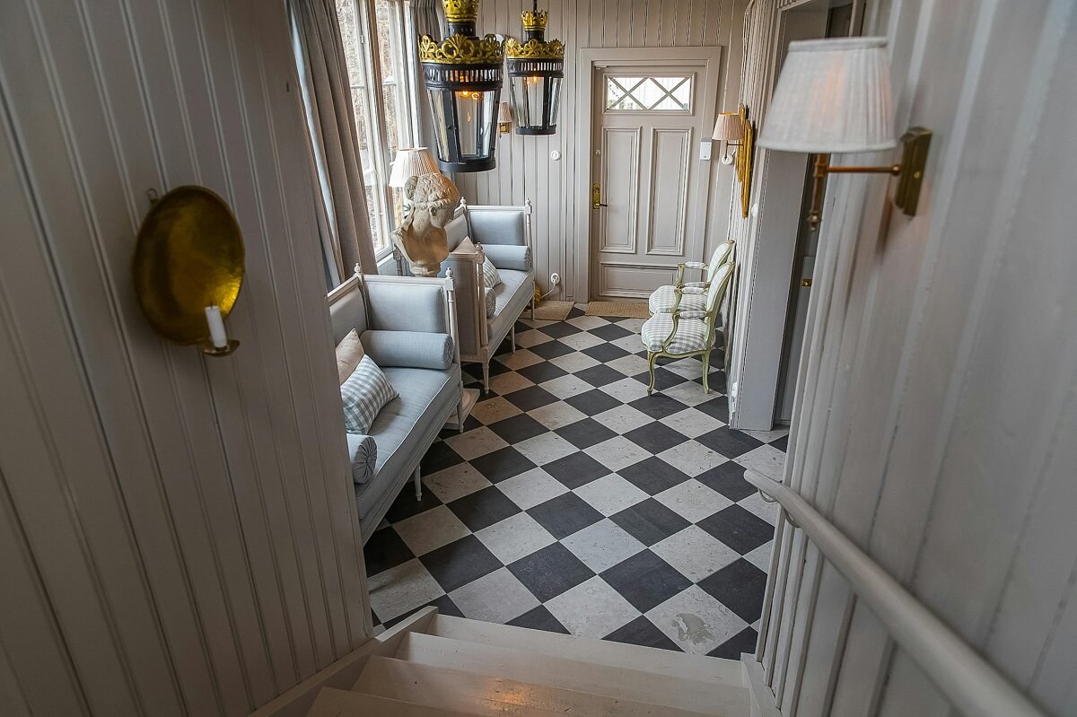 Best of 2024: Hallways 13 view into hall with checkerboard floor luxurious summer house sweden nordroom