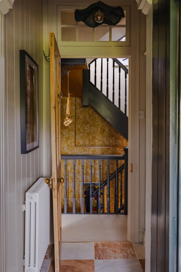 A Rich Color Palette in a Historic English Home 17 view into hall