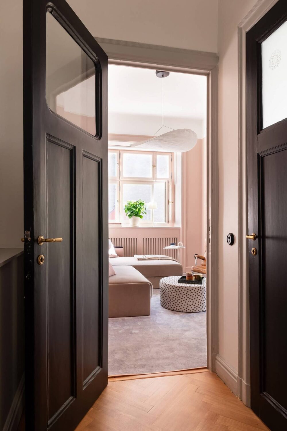 An Elegant Turn-of-the-Century Apartment in Stockholm 18 view into pink sitting room