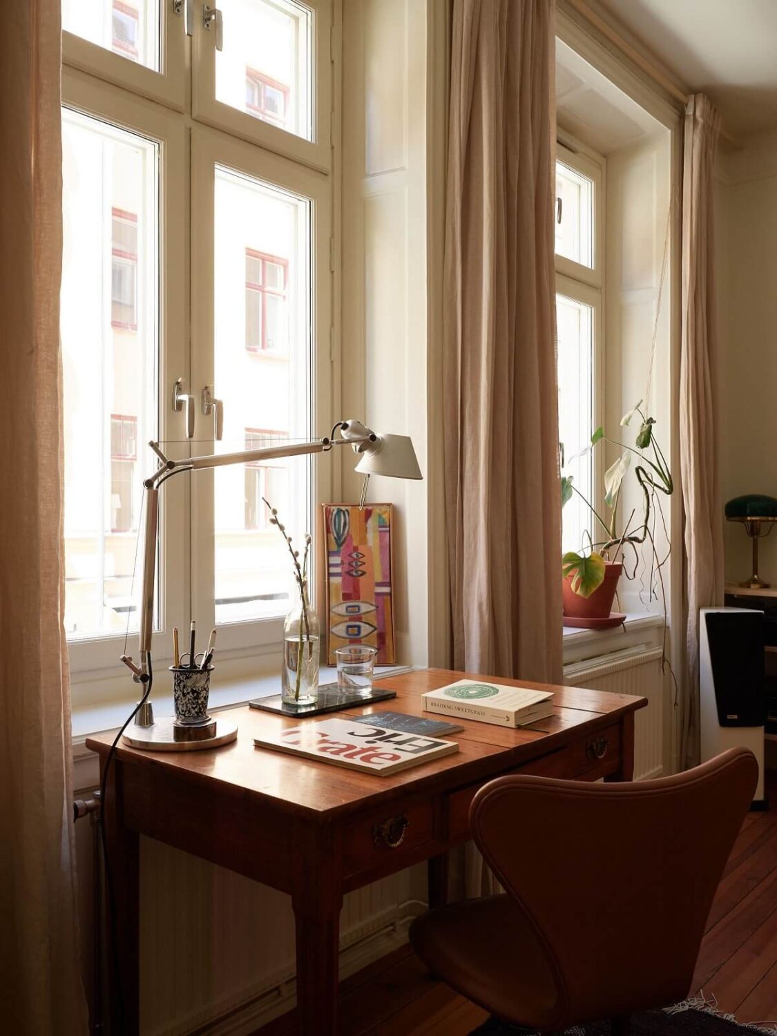 Warm Tones and a Blue Hallway in a Stockholm Apartment 7 vintage desk in living room