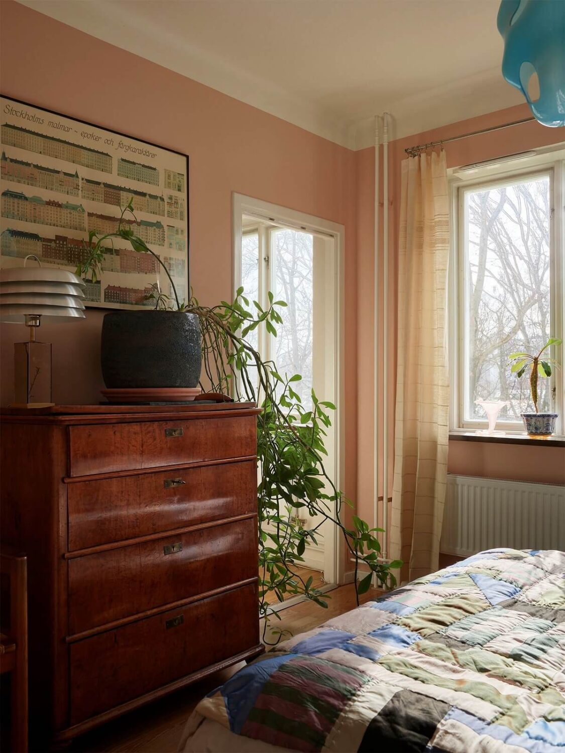 A Swedish Apartment with a Restored Original Kitchen 16 vintage dresser in pink bedroom