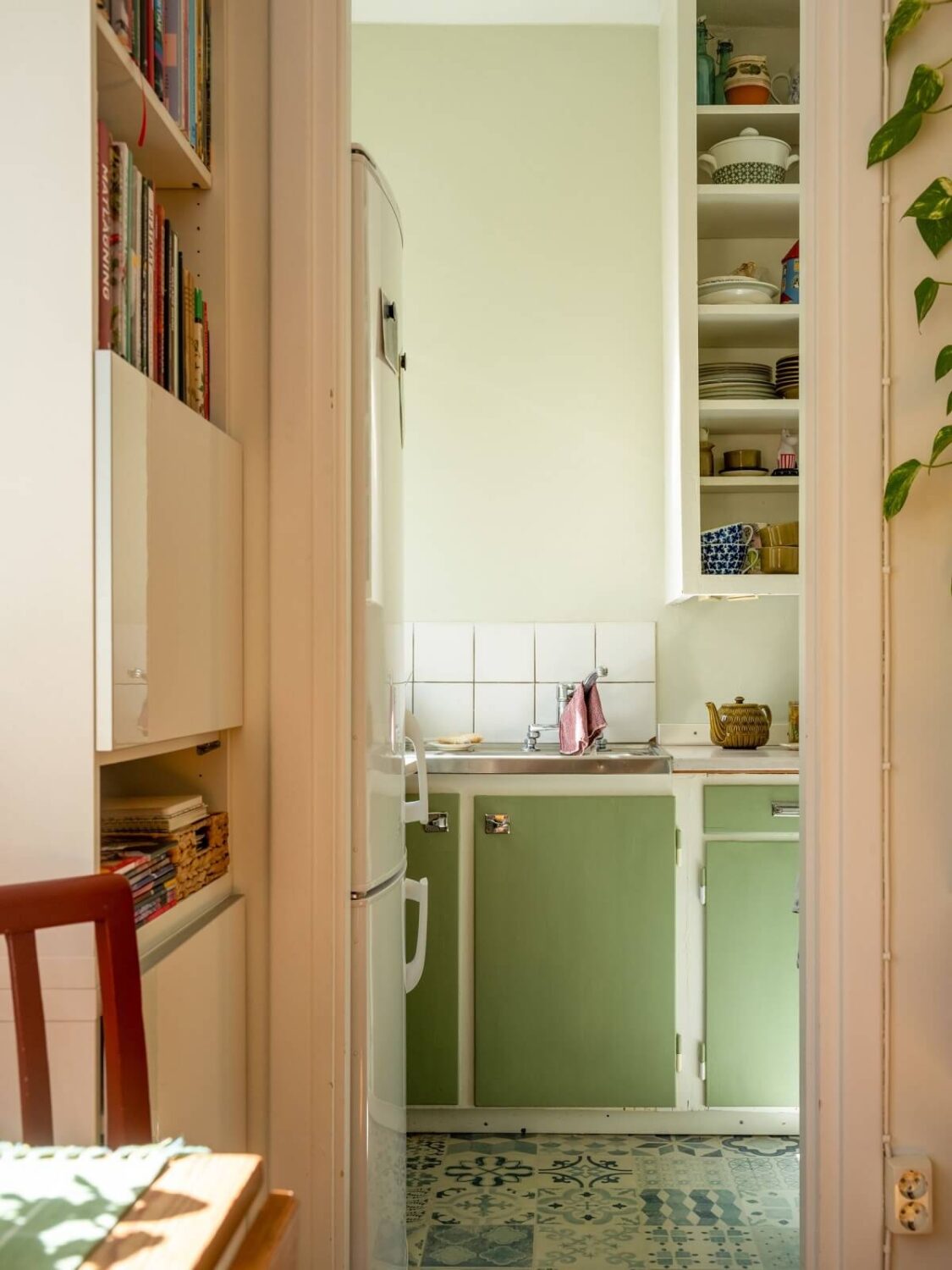 A Studio Apartment with Vintage Green Cabinets 10 vintage kitchen with green doors