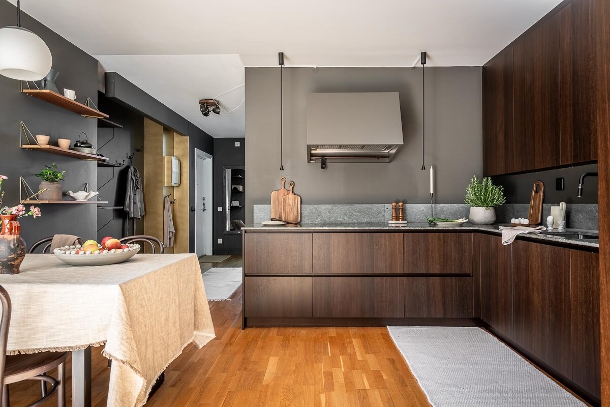 Floor-to-Ceiling Bookcases and Windows in a Loft Style Apartment 13 walnut kitchen with gray walls nordroom
