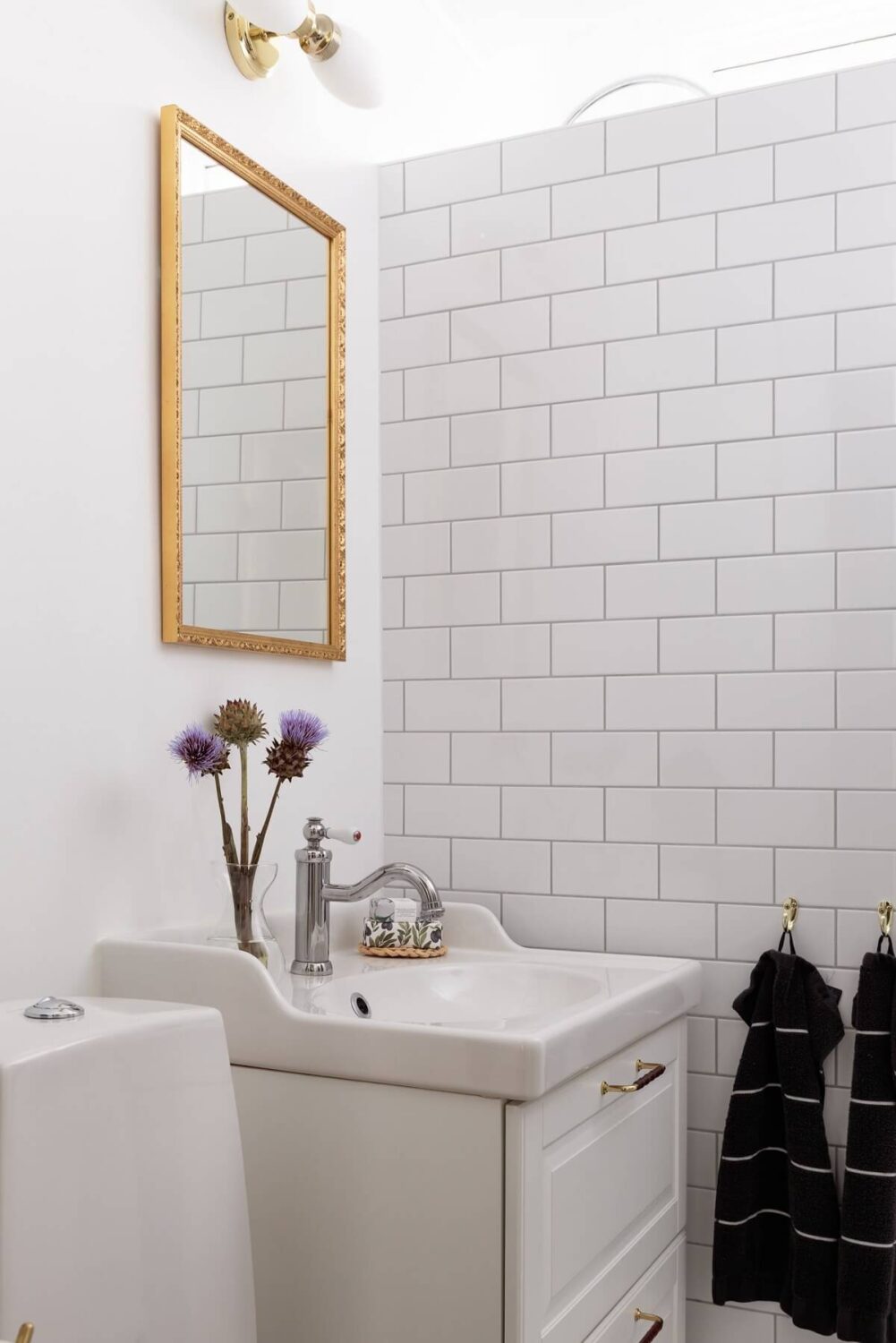 A Swedish Duplex with a Unique Wood and Pastel Colored Kitchen 19 white bathroom