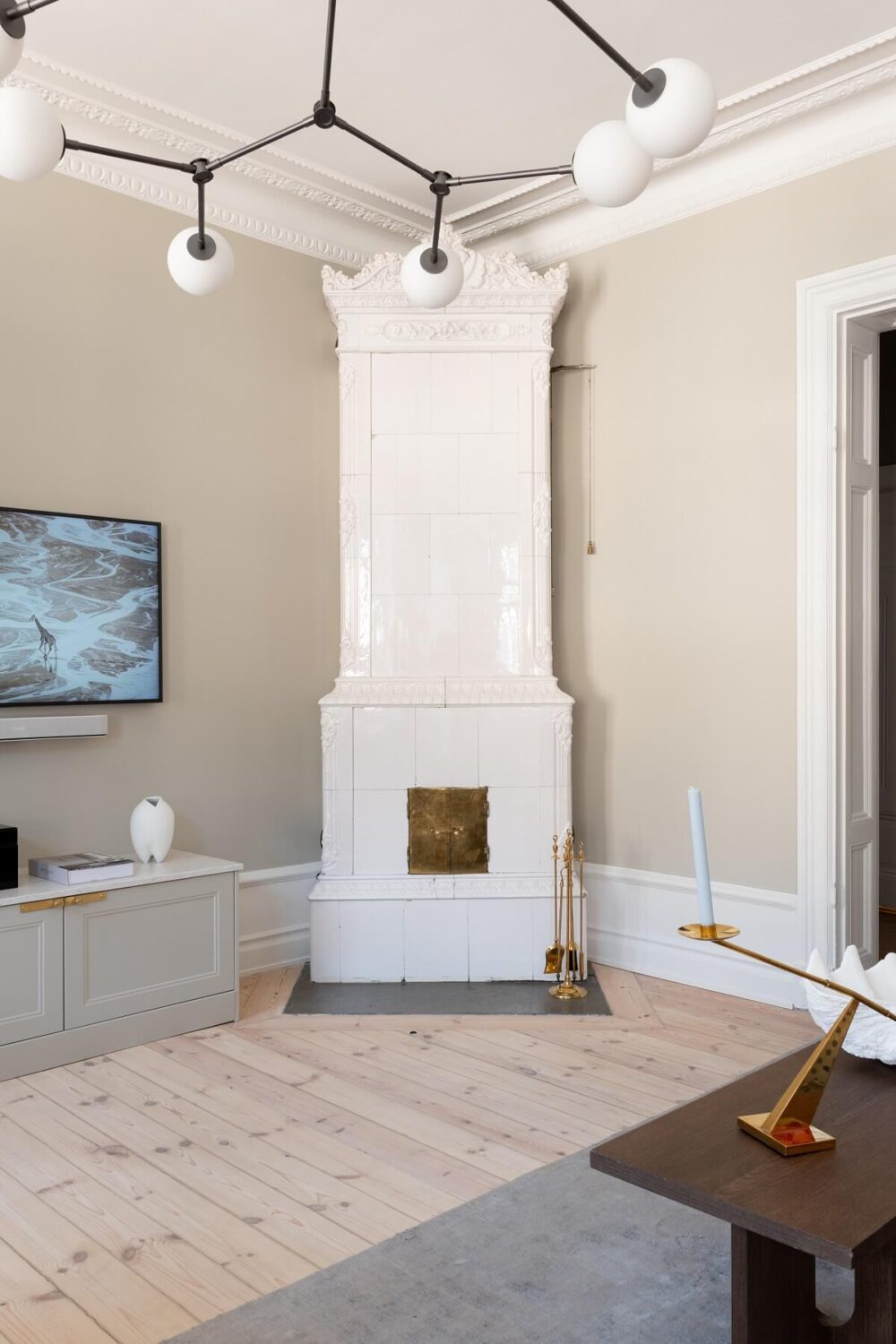 A Light Renovated Apartment in Stockholm 6 white fireplace