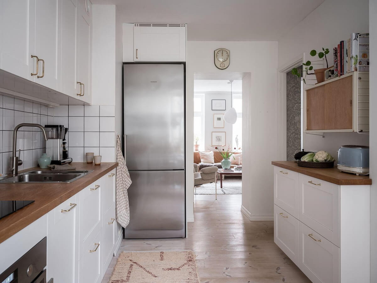 A Light Two Bedroom Apartment in Gothenburg 22 white kitchen