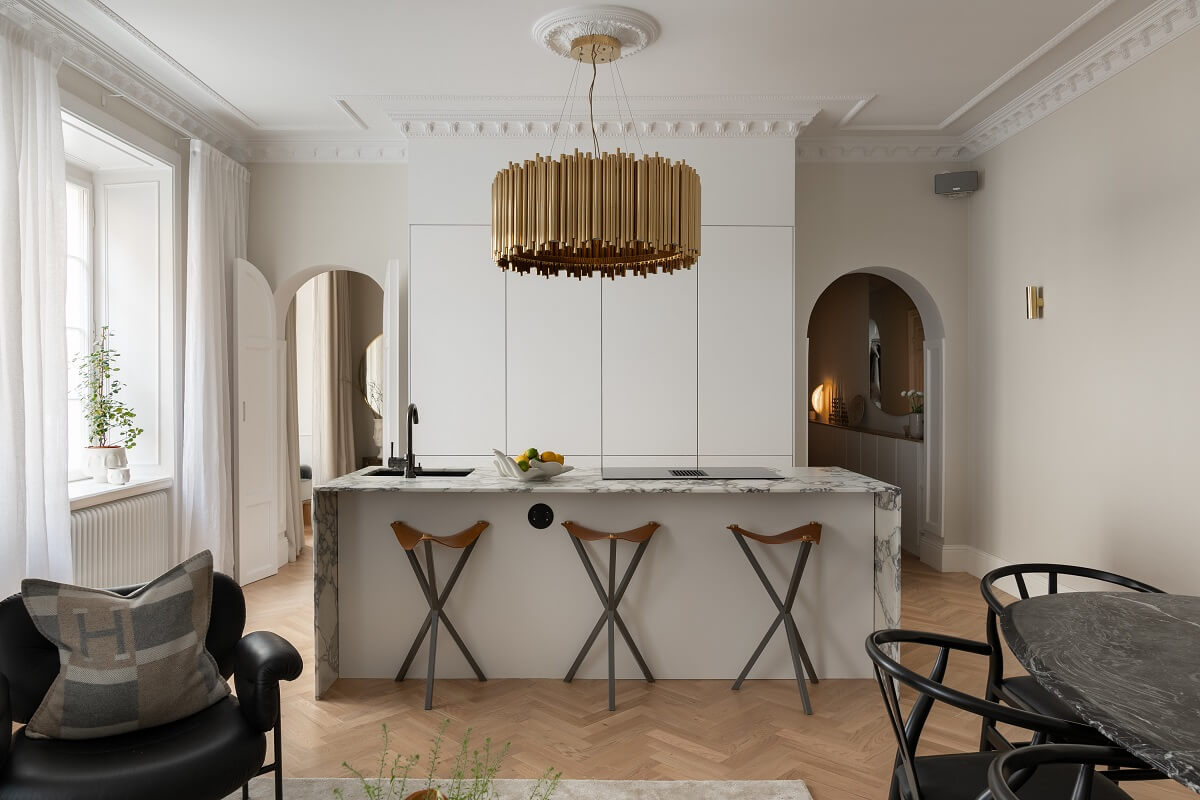 A Classic Look for a Swedish Apartment 7 white kitchen with flanked by arched doorways nordroom