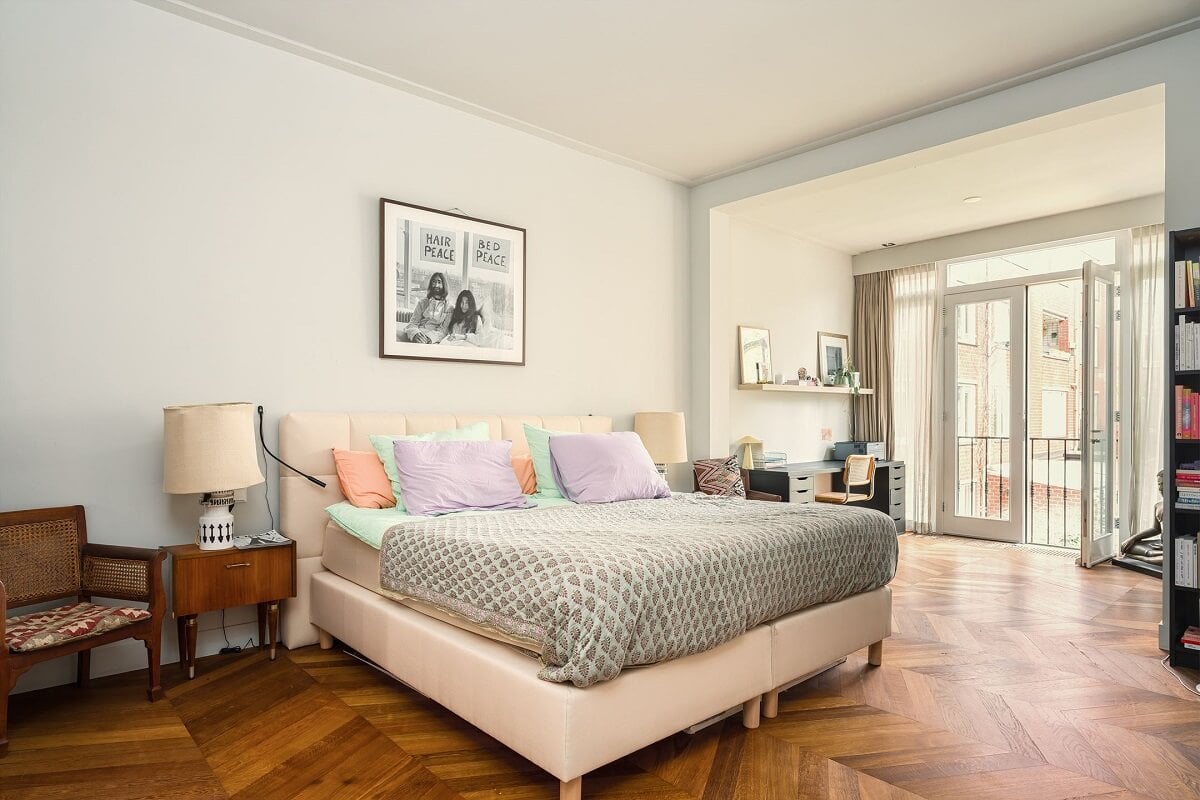 A Colorful Family Home with Open-Plan Spaces in Amsterdam 12 white master bedroom wooden floor