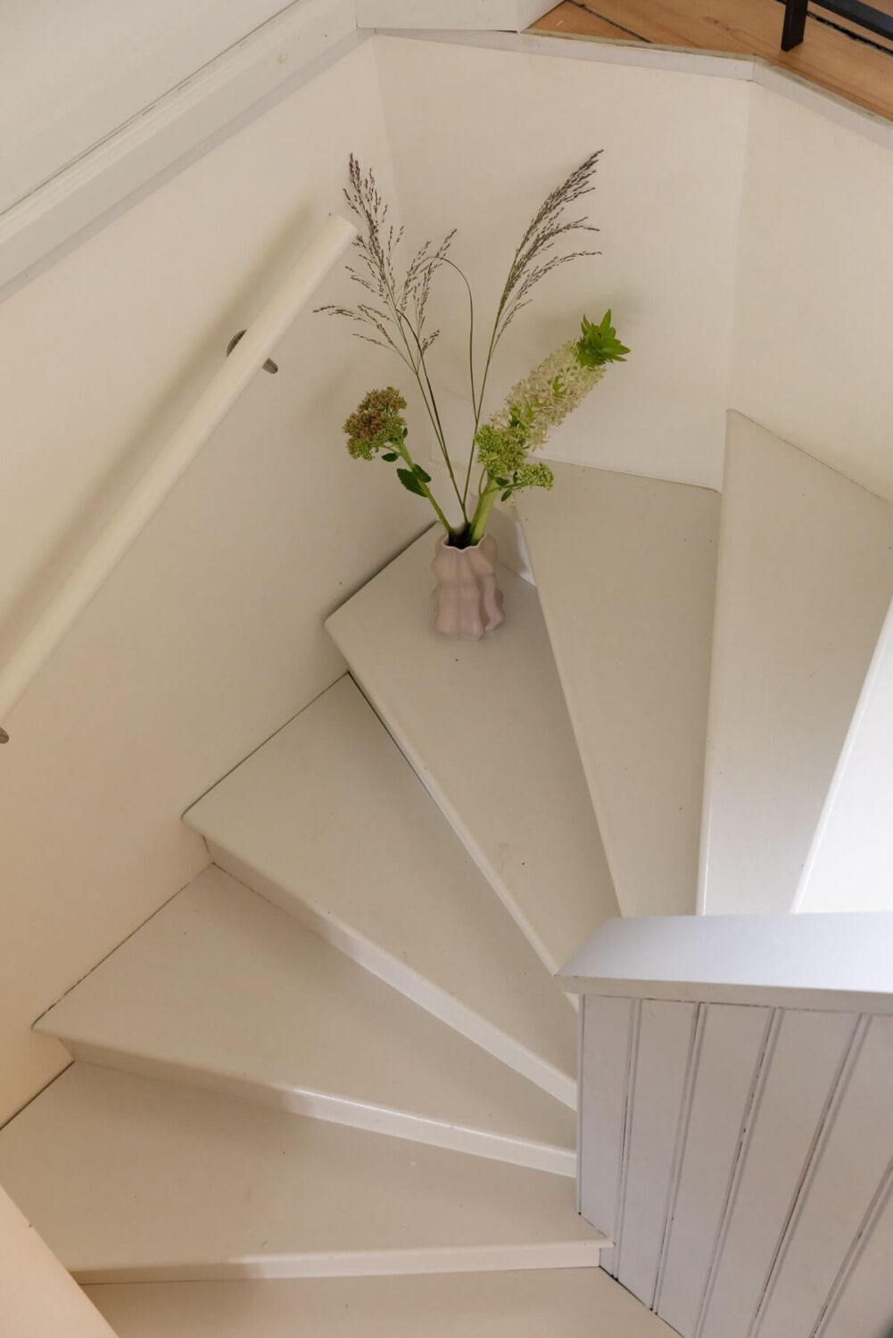 A Swedish Duplex with a Unique Wood and Pastel Colored Kitchen 13 white staircase