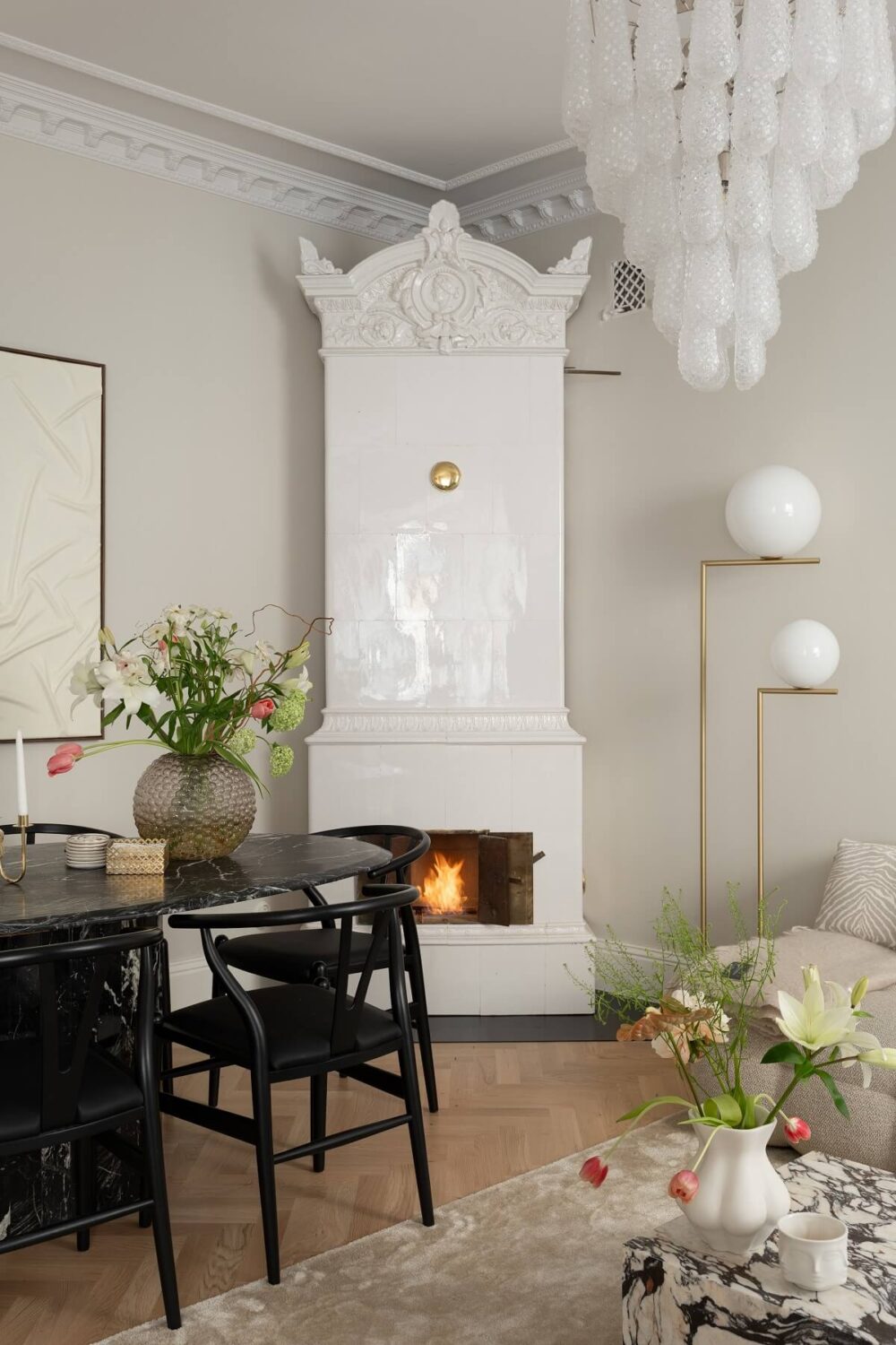 A Classic Look for a Swedish Apartment 2 white tiled fireplace in living room