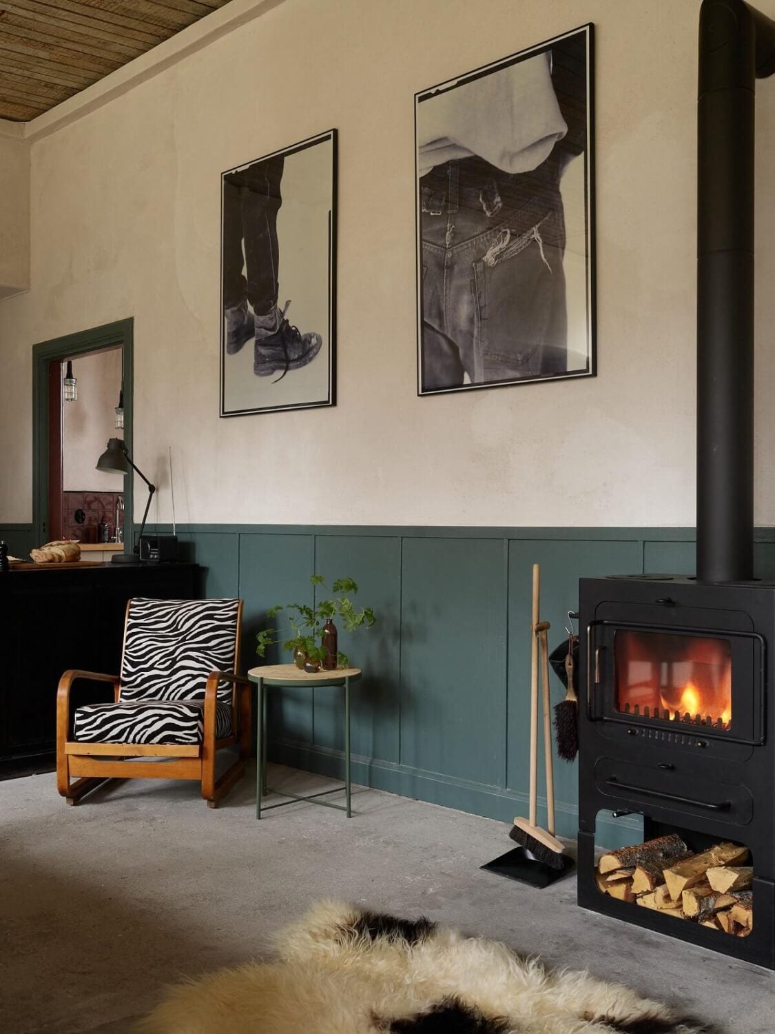 A Charming School Conversion in Sweden 5 woodburner and wood paneled walls
